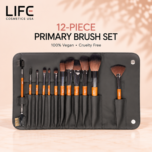 LIFE Cosmetics USA 12-piece primary makeup brush set with wooden handles arranged in an open black storage pouch.