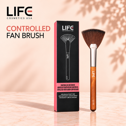 LIFE Cosmetics USA LC16 Controlled Fan Brush with fan-shaped bristles and a wooden handle beside its black and pink retail box.