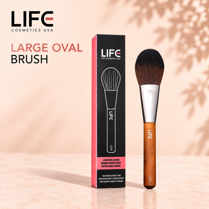 LIFE Cosmetics USA LC10 Large Oval Brush with a wooden handle beside its black and pink retail box.