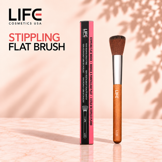 LIFE Cosmetics USA LC20 Stippling Flat Brush with a wooden handle beside its slim black and pink retail box.