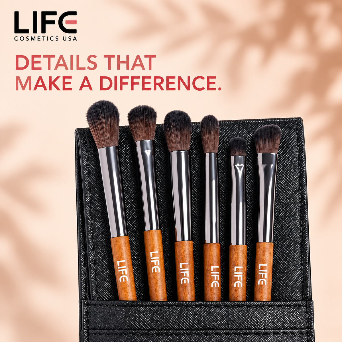 Close-up of six LIFE Cosmetics USA blending and shading brushes with wooden handles and varied bristle shapes in a black pouch.
