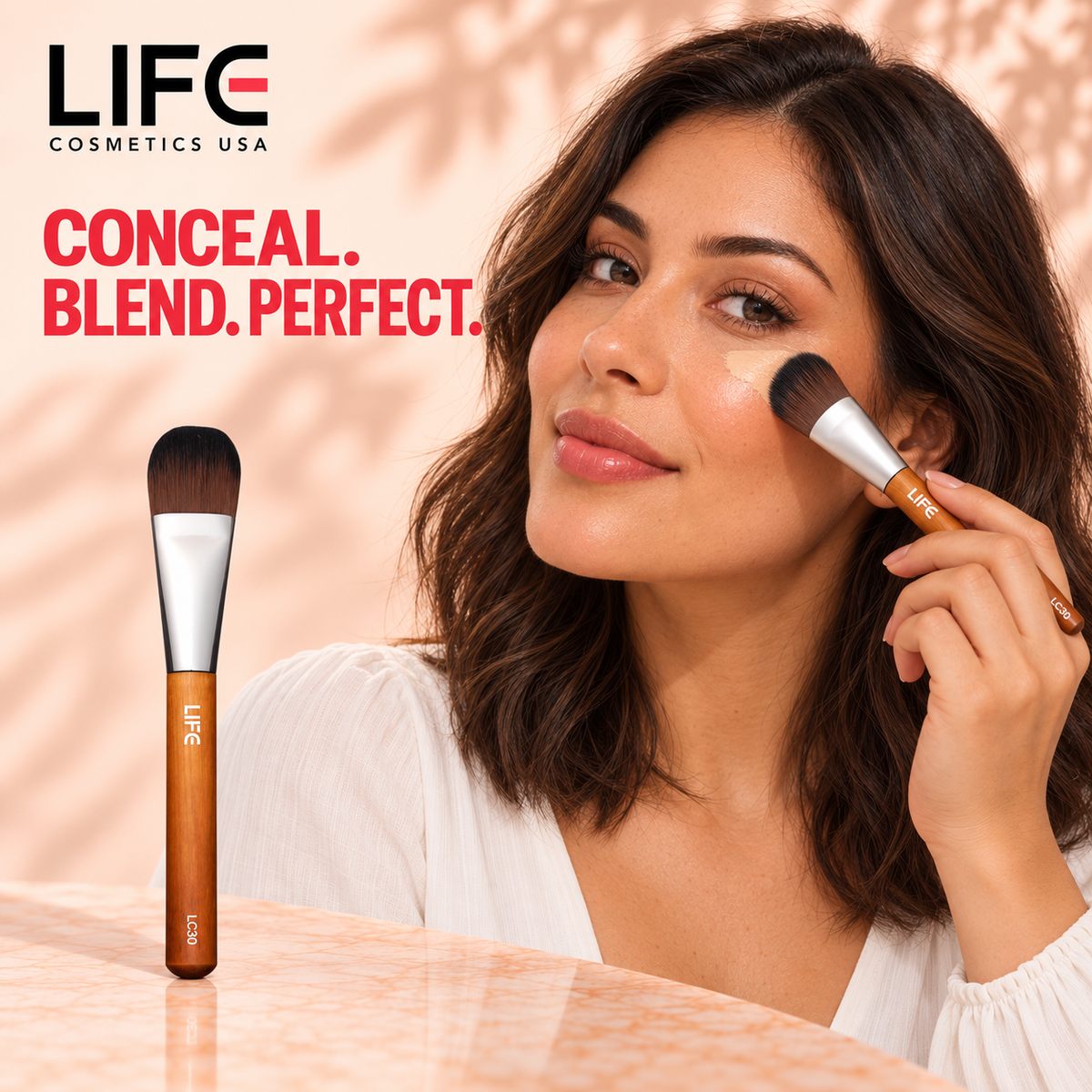 Woman blending concealer beneath her eye with the LIFE Cosmetics USA LC30 Edged Eye Foundation Brush, beside a full-length brush view.