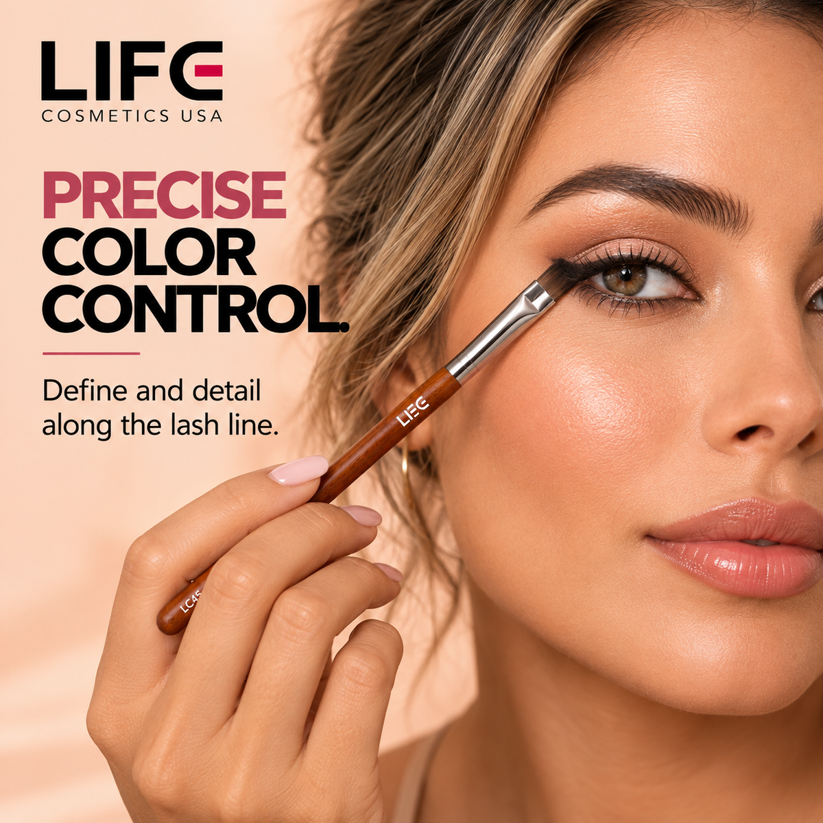 Close-up of a woman defining her upper lash line with the LIFE Cosmetics USA LC45 Chisel Detailing Brush.