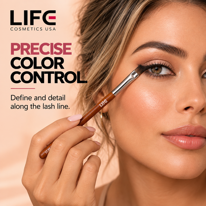 Close-up of a woman defining her upper lash line with the LIFE Cosmetics USA LC45 Chisel Detailing Brush.