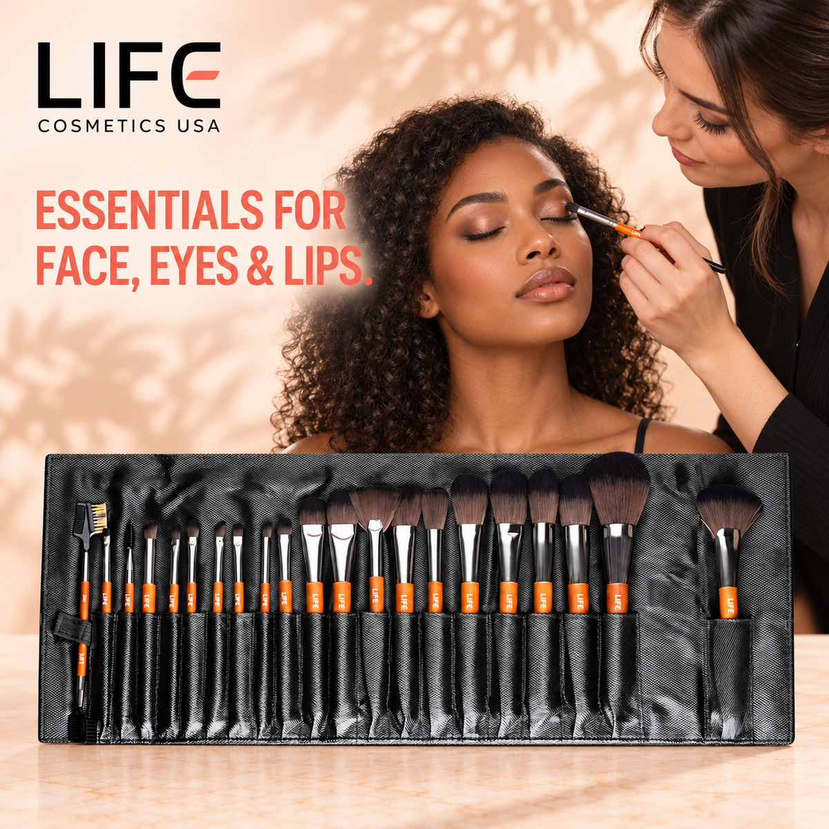 Makeup artist applying eyeshadow to a woman behind the LIFE Cosmetics USA 21-piece brush set in an open black pouch.