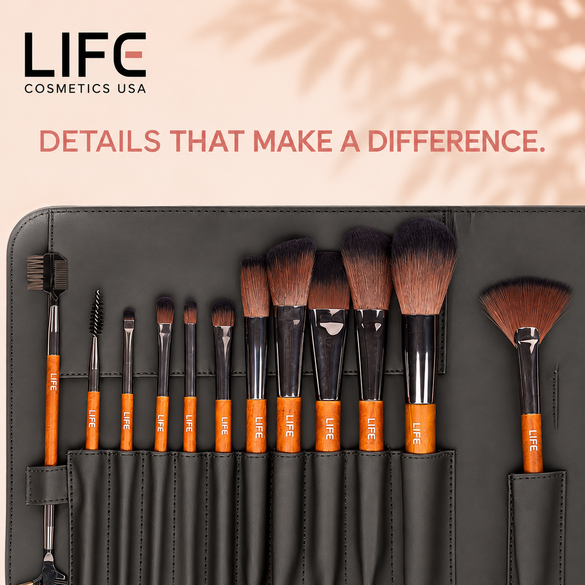 Close-up of the LIFE Cosmetics USA 12-piece primary makeup brush set, showing varied brush shapes and wooden handles in a black pouch.