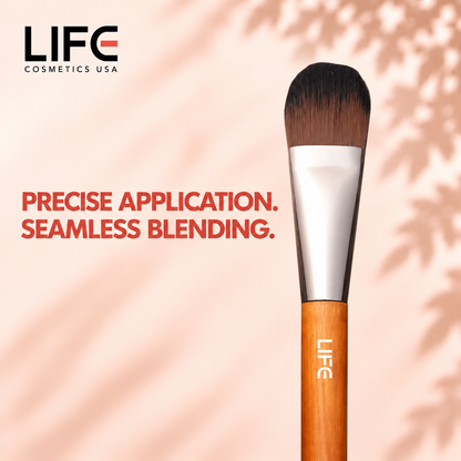 Close-up of the LIFE Cosmetics USA LC30 Edged Eye Foundation Brush showing rounded bristles, a silver ferrule and wooden handle.