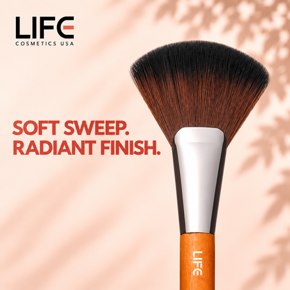 Close-up of the LIFE Cosmetics USA LC15 Deluxe Fan Brush showing fan-shaped bristles, a silver ferrule and wooden handle.