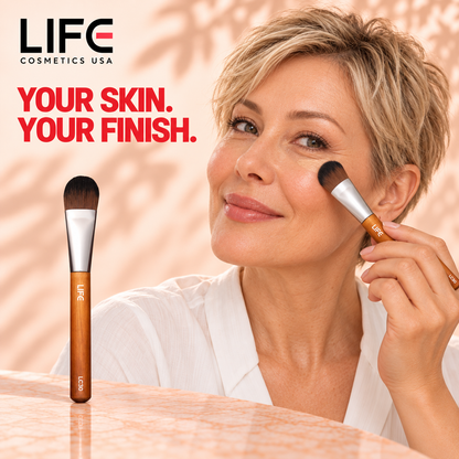 Woman with short blonde hair blending makeup beneath her eye with the LIFE Cosmetics USA LC30 brush, beside a full-length brush view.
