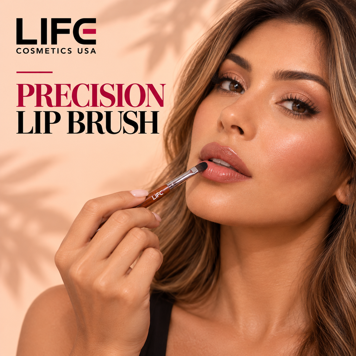 Woman applying glossy pink lip color with the LIFE Cosmetics USA LC55 Precision Lip Brush, holding its wooden handle with the rounded bristles against her lower lip.