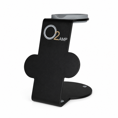 Black O2AMP Professional dryer stand with a gray top cradle, O2AMP logo, two circular attachment holders, and a rounded base on white.