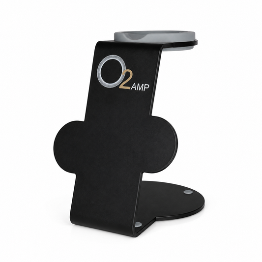 Black O2AMP Professional dryer stand with a gray top cradle, O2AMP logo, two circular attachment holders, and a rounded base on white.