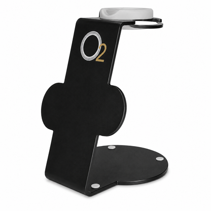 Black O2 Professional hair dryer stand with a white top cradle, two circular attachment holders, and a rounded base on white.