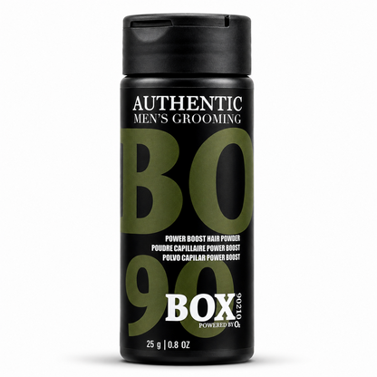 Black BOX90210 Power Boost Hair Powder bottle with olive-green and white lettering, labeled 25 g / 0.8 oz, shown on white.