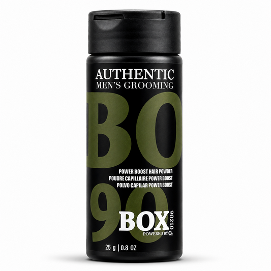 Black BOX90210 Power Boost Hair Powder bottle with olive-green and white lettering, labeled 25 g / 0.8 oz, shown on white.