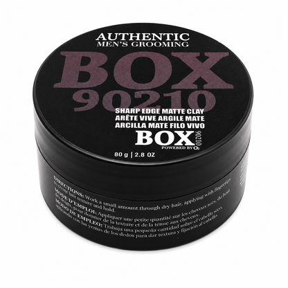 Black BOX90210 Sharp Edge Matte Clay jar with muted purple and white lettering on its lid, labeled 80 g / 2.8 oz, shown on white.