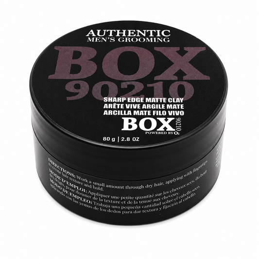 Black BOX90210 Sharp Edge Matte Clay jar with muted purple and white lettering on its lid, labeled 80 g / 2.8 oz, shown on white.