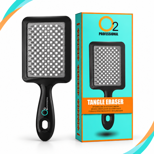 Black O2 Tangle Eraser brush with a gray pad and white-tipped bristles beside its turquoise-and-orange retail box.