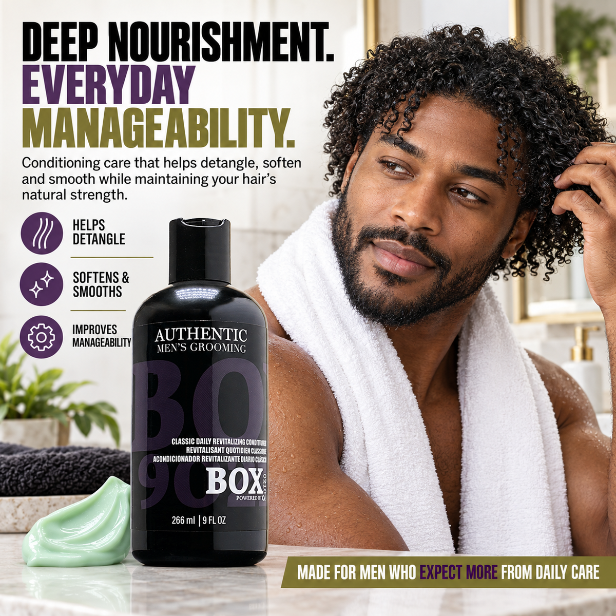 Man touching his curly hair with a white towel around his shoulders beside a BOX90210 Classic Daily Revitalizing Conditioner bottle and pale-green cream.