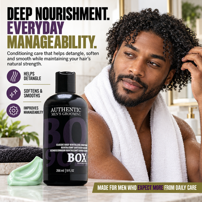 Man touching his curly hair with a white towel around his shoulders beside a BOX90210 Classic Daily Revitalizing Conditioner bottle and pale-green cream.