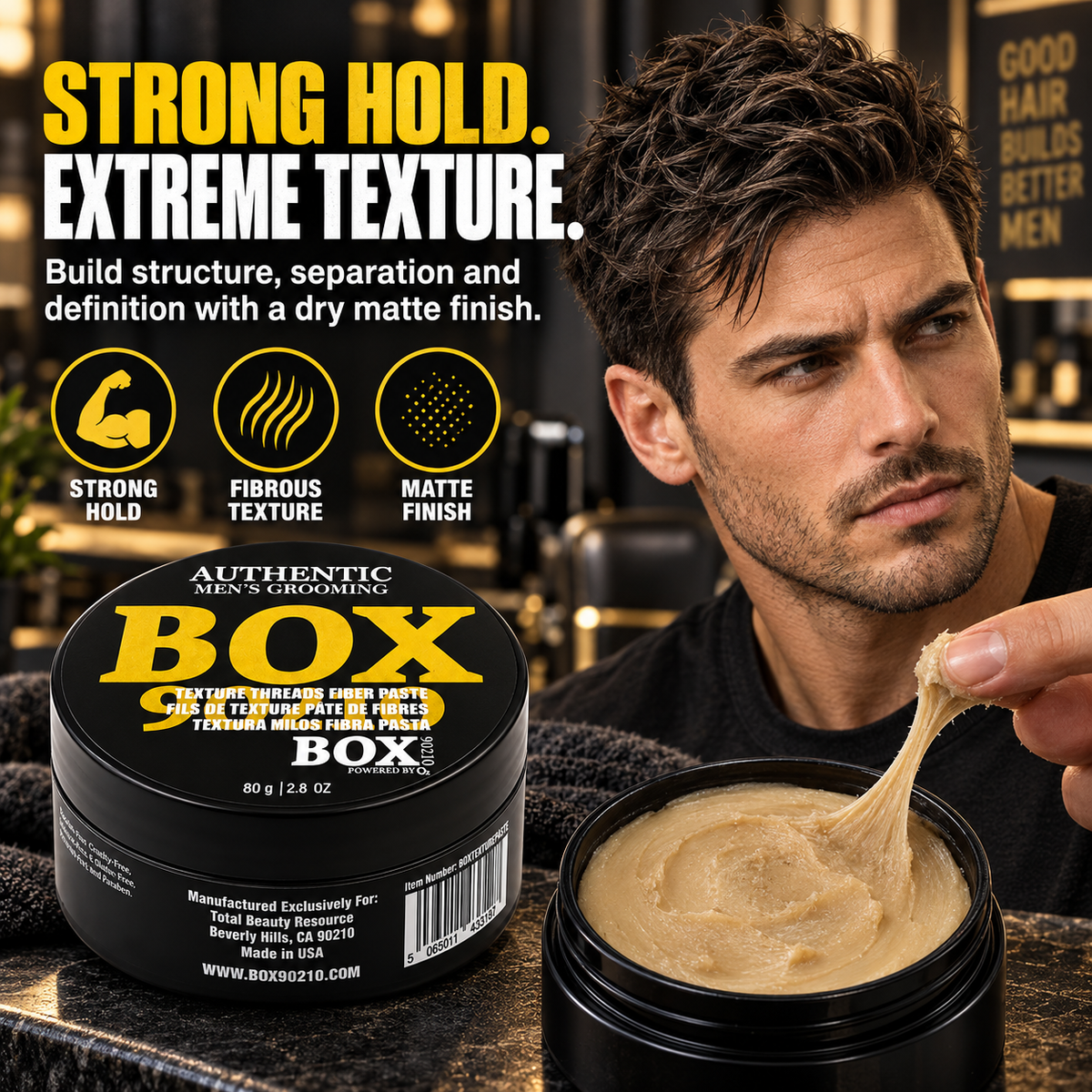 Man with textured dark hair stretching paste from an open BOX90210 Texture Threads Fiber Paste jar beside a closed jar and strong-hold, fibrous-texture and matte-finish callouts.