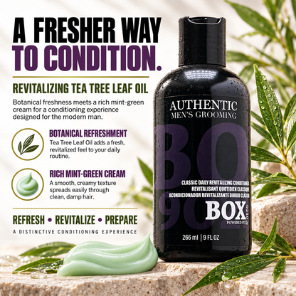 BOX90210 Classic Daily Revitalizing Conditioner bottle beside green leaves and mint-green cream, with tea tree leaf oil and cream-texture callouts.