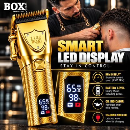 Gold BOX90210 1126 clipper with an enlarged LED display showing speed, battery level, oil and charging indicators beside a barber scene.