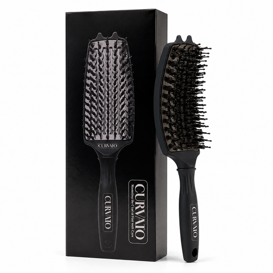 Black CURVATO curved thermal brush with rounded bristle tips and a hanging hole in the handle, shown beside its matching black retail box on white.