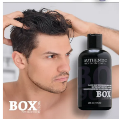 Man with styled hair holding a bottle of 'BOX' hair product.
