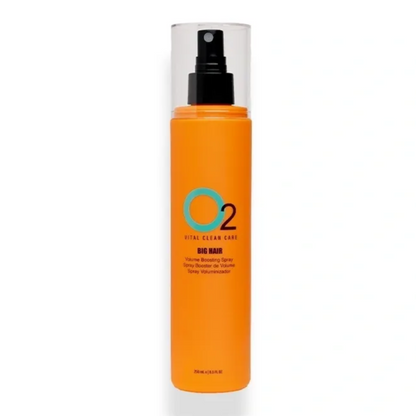 Orange spray bottle with black nozzle on a white background