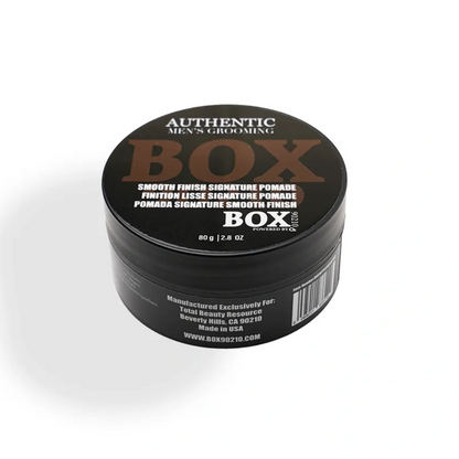 Black container with 'BOX' branding on a white background