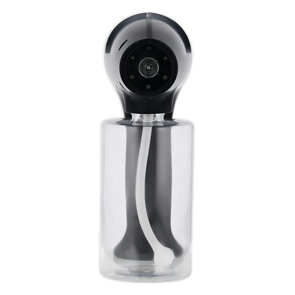 Clear spray bottle with black nozzle on a white background