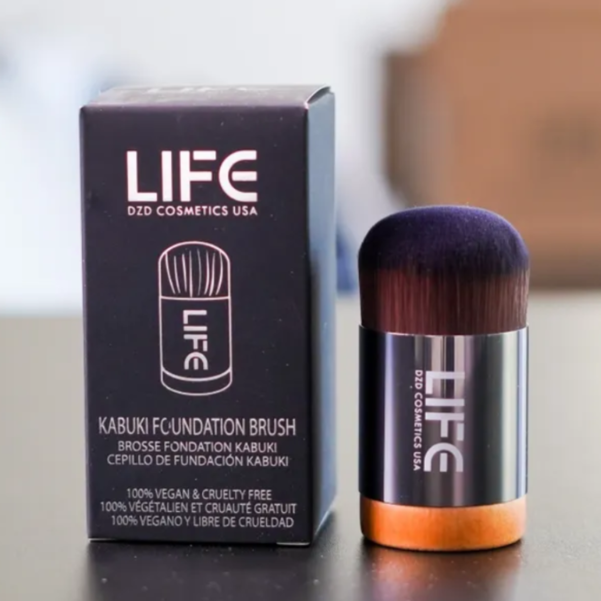LIFE skincare product and packaging on a blurred background