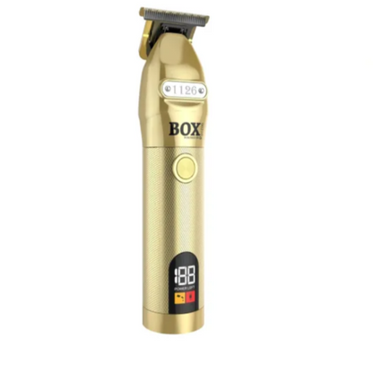 Gold hair trimmer on a white background