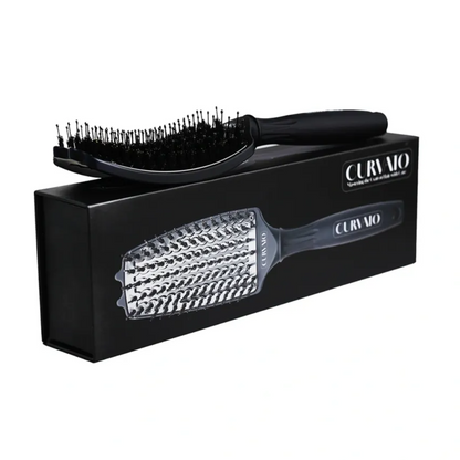 Black hairbrush with clear bristle side and black handle on a white background