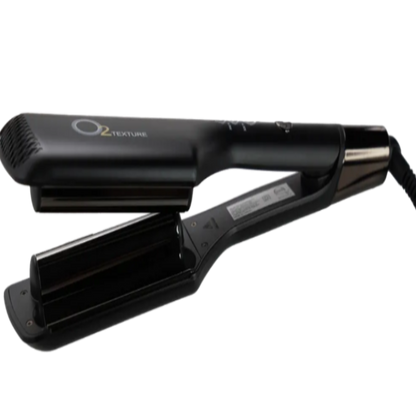 Black hair straightener with gold accents on a white background