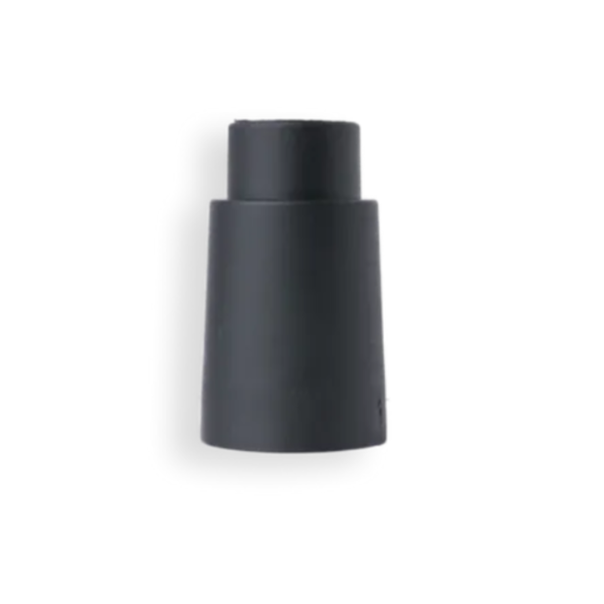 Black cylindrical object on a white background