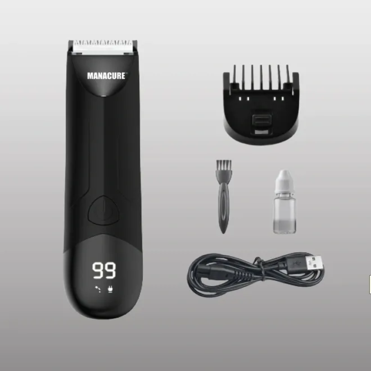 Black hair trimmer with accessories on a gray background