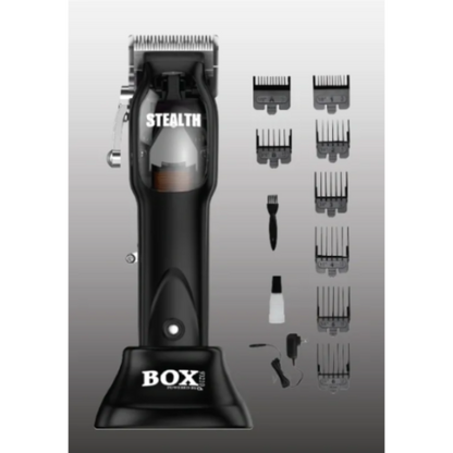 Black hair clipper with attachments on a gray background